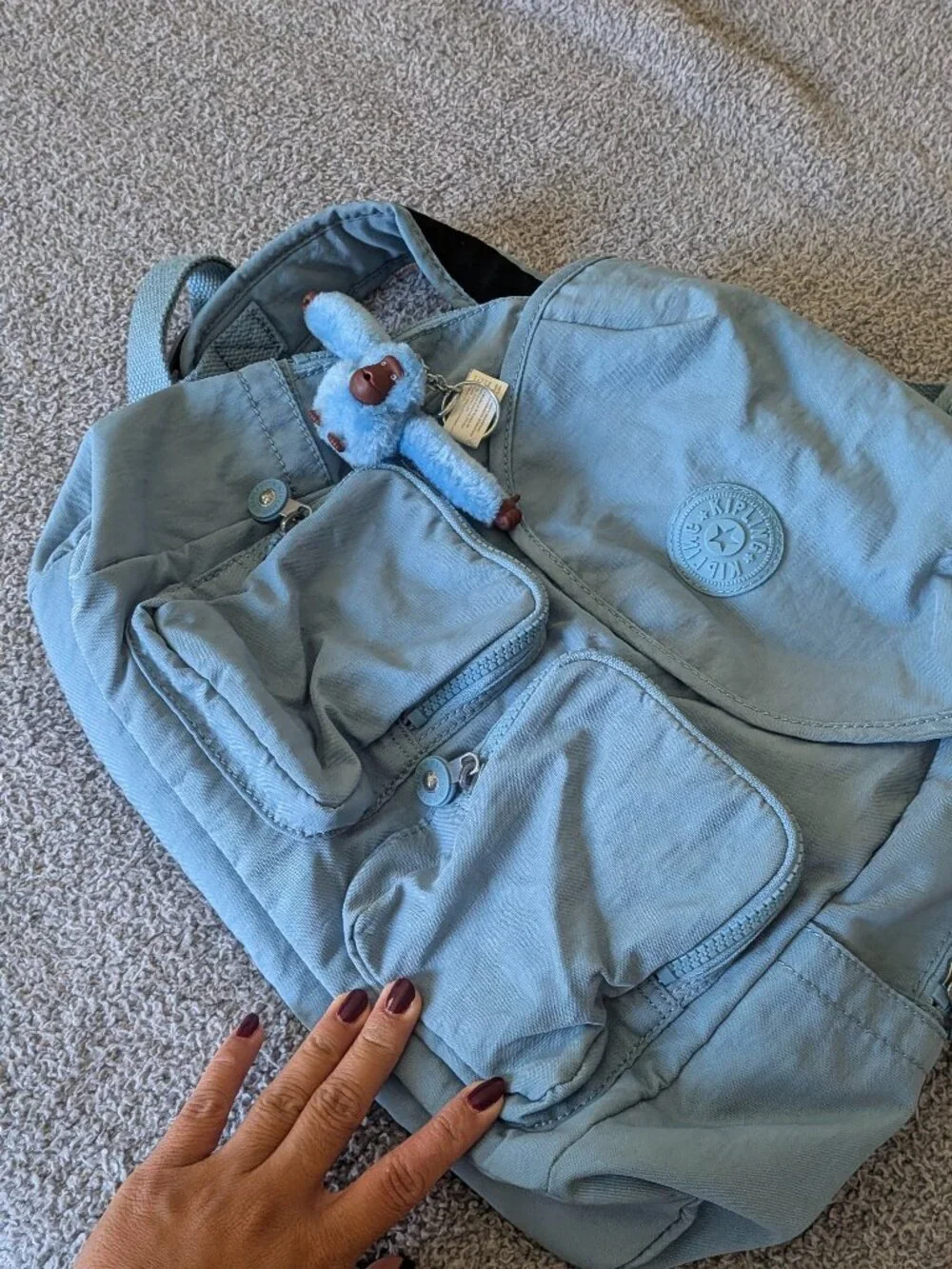 Kipling blue backpack with keychain